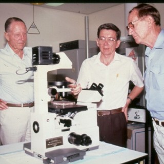 1980s Harry Giese and John Mathews with new microscope for Chlamydia