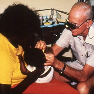 Menzies ENT specialist Albert Foreman doing ear examination in the NT in the late 1980s